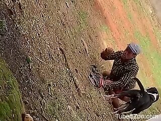 Old man fucked in the ass by the dog in outdoor scenes