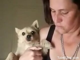 Solo mature is horny and wants to suck her dog's little cock